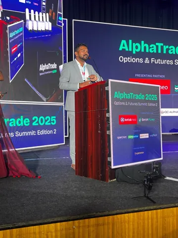 Dharanidharan at the podium at the AlphaTrade 2025 summit